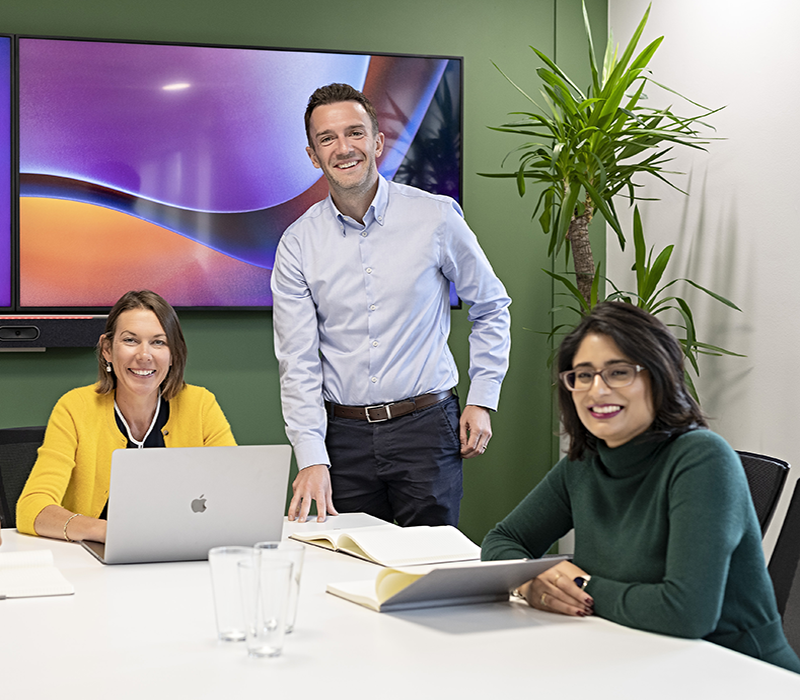 Three people in a meeting room, EBP team