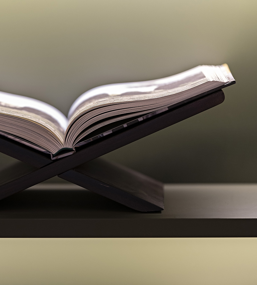 A book open on a stand