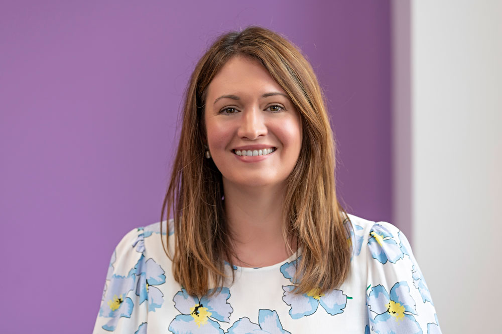A woman in a floral top
