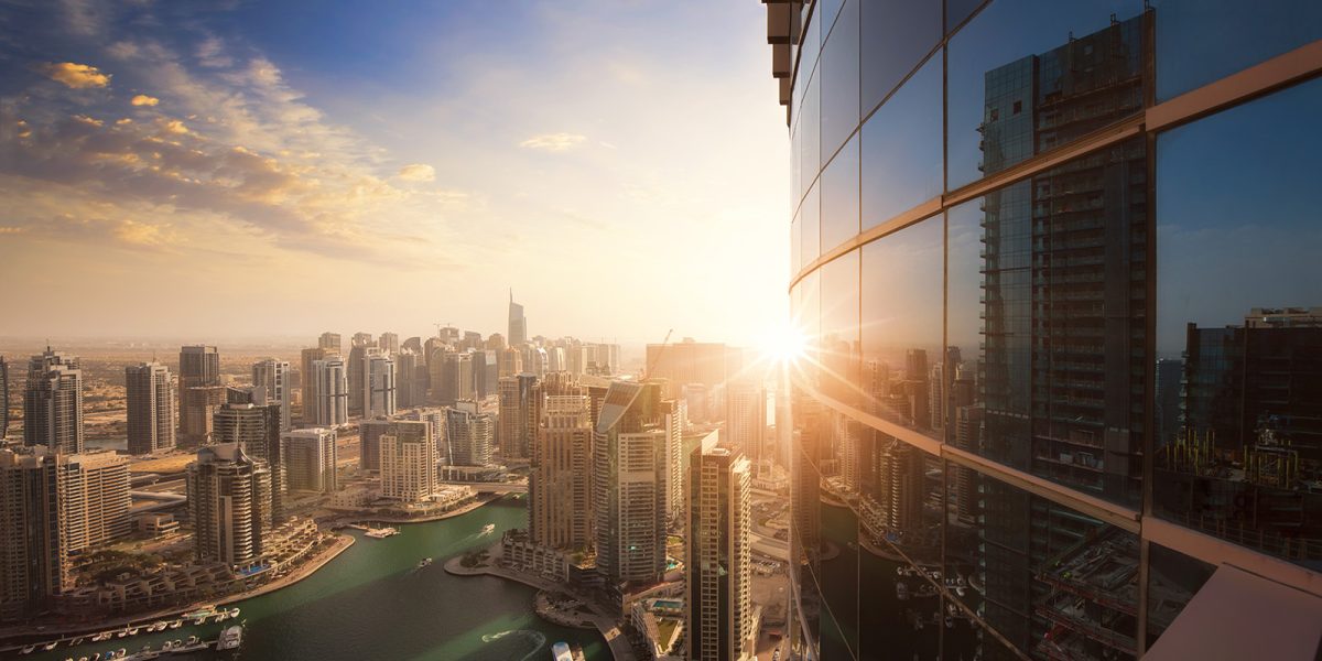 A city skyline with sunset