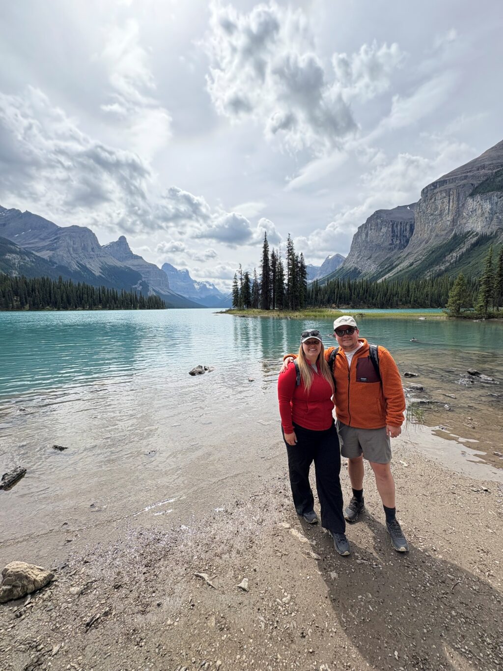 Couple standing by a lake