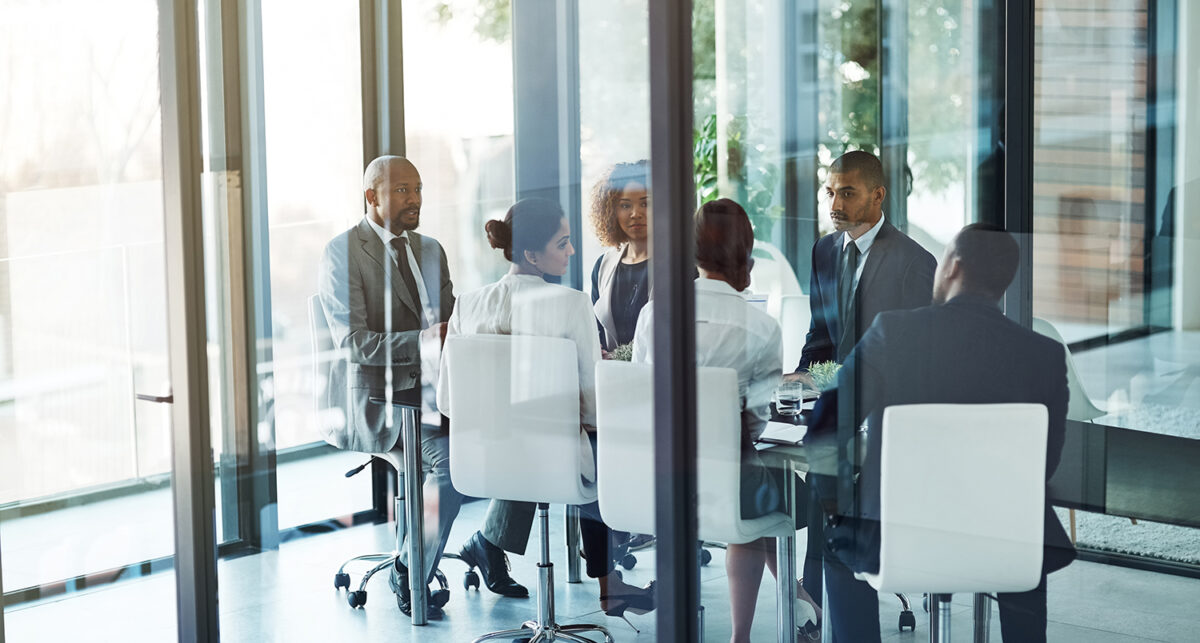 Shot of a team of professionals having a meeting in the boardroom at work